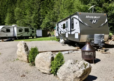 RV trailers at a forested campground